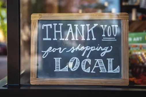 Stock image of a chalk board that says "Thank you for shopping local"